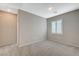 Bright bedroom with gray walls and neutral carpet at 8562 Insignia Ave # 102, Las Vegas, NV 89178