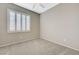 Neutral bedroom with plush carpet and plantation shutters at 8562 Insignia Ave # 102, Las Vegas, NV 89178