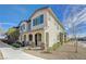 Charming two-story townhome with a covered porch and desert landscaping at 8562 Insignia Ave # 102, Las Vegas, NV 89178