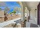 Welcoming covered porch with stone-clad columns and a view of the landscaped walkway at 8562 Insignia Ave # 102, Las Vegas, NV 89178