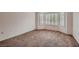 Spacious bedroom with a bay window, neutral carpet, and lots of natural light at 8613 Linderwood Dr, Las Vegas, NV 89134