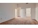 Neutral-toned bedroom showing closet space, access doors, and neutral carpeting at 8613 Linderwood Dr, Las Vegas, NV 89134