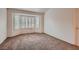 Large bedroom with a bay window providing ample natural light and neutral carpet at 8613 Linderwood Dr, Las Vegas, NV 89134