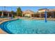 Resort-style pool area with ample lounge seating, water features, and mountain views at 8613 Linderwood Dr, Las Vegas, NV 89134