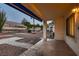 Covered patio with tile flooring offers shade and relaxation overlooking desert landscaping and beautiful desert views at 8613 Linderwood Dr, Las Vegas, NV 89134
