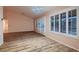 Bright dining area with wood flooring, plantation shutters and access to the living room at 8613 Linderwood Dr, Las Vegas, NV 89134
