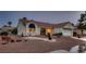Charming single-story home with a well-manicured desert landscape and classic architectural details at 8613 Linderwood Dr, Las Vegas, NV 89134