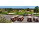 Several golf carts on a golf course with a view of the mountains at 8613 Linderwood Dr, Las Vegas, NV 89134