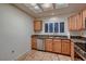 This kitchen offers great light, stainless steel appliances, and granite countertops at 8613 Linderwood Dr, Las Vegas, NV 89134