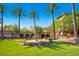 Beautiful water fountain in a lush garden setting with Mediterranean-style building in the background at 8613 Linderwood Dr, Las Vegas, NV 89134