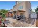 Backyard featuring a covered patio, a grill, a storage shed, and rock landscaping at 9065 W Torino Ave, Las Vegas, NV 89148