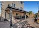 Backyard featuring a covered patio with outdoor furniture, a grill, and low-maintenance brick landscaping at 9065 W Torino Ave, Las Vegas, NV 89148