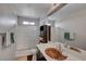 Well-lit bathroom featuring a unique mosaic sink and shower-tub combo with white tiled walls at 9065 W Torino Ave, Las Vegas, NV 89148