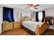 Inviting bedroom featuring warm, wood-style flooring and natural light at 9065 W Torino Ave, Las Vegas, NV 89148