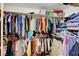 Fully stocked walk-in closet provides ample space for clothing and storage in an organized manner at 9065 W Torino Ave, Las Vegas, NV 89148