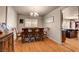 Dining room with wood floors, traditional furniture, and backyard access at 9065 W Torino Ave, Las Vegas, NV 89148