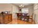 Traditional dining room with wood floors, large table, and elegant chandelier at 9065 W Torino Ave, Las Vegas, NV 89148