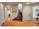Inviting foyer with hardwood floors, staircase, and ample natural light at 9065 W Torino Ave, Las Vegas, NV 89148