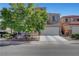 Charming two-story home featuring an attached two-car garage and a well-maintained front yard at 9065 W Torino Ave, Las Vegas, NV 89148