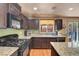 Bright kitchen features granite counters, stainless appliances and ample storage space at 9065 W Torino Ave, Las Vegas, NV 89148