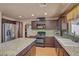 Well-equipped kitchen features granite countertops, stainless steel appliances, and ample cabinet space at 9065 W Torino Ave, Las Vegas, NV 89148