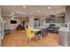 Open eat-in kitchen with dark cabinets, granite counters, and breakfast nook with seating at 9065 W Torino Ave, Las Vegas, NV 89148