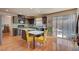 Eat-in kitchen featuring dark cabinetry, granite countertops, island, and stainless steel appliances at 9065 W Torino Ave, Las Vegas, NV 89148