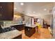 Spacious kitchen featuring granite countertops, stainless steel appliances, and an island with seating at 9065 W Torino Ave, Las Vegas, NV 89148