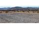 Vacant land featuring mountain views and desert landscape; ideal for building a custom home at 9065 W Torino Ave, Las Vegas, NV 89148
