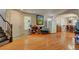 Open living area with hardwood floors, front door, and staircase at 9065 W Torino Ave, Las Vegas, NV 89148