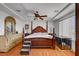 Spacious main bedroom features stylish furniture, a ceiling fan, and plenty of natural light at 9065 W Torino Ave, Las Vegas, NV 89148