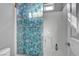 A full shower featuring unique shower door design with tile surround at 9065 W Torino Ave, Las Vegas, NV 89148