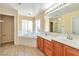 Bathroom featuring a tub, tiled backsplash, double sink vanity and modern fixtures at 9324 Freedom Heights Ave, Las Vegas, NV 89149