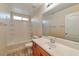 Clean bathroom featuring a shower-tub combination, tile, and vanity sink at 9324 Freedom Heights Ave, Las Vegas, NV 89149