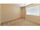 Bedroom with plush carpeting, a window, and ample natural light at 9324 Freedom Heights Ave, Las Vegas, NV 89149