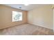 Bedroom with plush carpeting, a window, and ample natural light at 9324 Freedom Heights Ave, Las Vegas, NV 89149