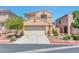 Charming two-story home featuring a two-car garage, well-maintained landscaping, and a welcoming facade at 9324 Freedom Heights Ave, Las Vegas, NV 89149