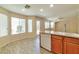 Bright kitchen with a breakfast bar, ample windows and light wood-look flooring at 9324 Freedom Heights Ave, Las Vegas, NV 89149
