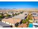 Beautiful residential community boasts manicured homes, lush trees, and a refreshing community pool with mountain views at 10742 Cowlite Ave, Las Vegas, NV 89166