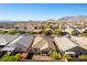 Charming residential area with well-maintained homes featuring cozy patios, lush greenery, and mountain views at 10742 Cowlite Ave, Las Vegas, NV 89166