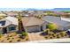Attractive single-story home with a well-maintained yard, complemented by a two-car garage and tile roofing at 10742 Cowlite Ave, Las Vegas, NV 89166