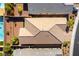 Stunning aerial view of a home with a tile roof, a pool, and lush landscaping at 10742 Cowlite Ave, Las Vegas, NV 89166