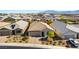 Inviting single-Gathering home with well-manicured landscaping, a two-car garage, and a charming tile roof at 10742 Cowlite Ave, Las Vegas, NV 89166