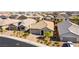 Desirable single-Gathering home with a two-car garage, paved driveway, desert landscaping, and tile roof at 10742 Cowlite Ave, Las Vegas, NV 89166