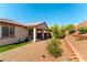Well-kept backyard features a covered patio, desert landscaping, and artificial turf for outdoor living at 10742 Cowlite Ave, Las Vegas, NV 89166