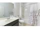 Bathroom with shower-tub combo, single sink vanity, and large mirror at 10742 Cowlite Ave, Las Vegas, NV 89166