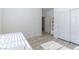 Bright bedroom features wood-look floors, closet, and view to doorway to another room at 10742 Cowlite Ave, Las Vegas, NV 89166