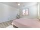 Bright bedroom with ceiling fan, window, light wood floor, and vanity table at 10742 Cowlite Ave, Las Vegas, NV 89166
