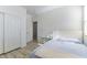 Bedroom with light wood floor, large window, and double door closet at 10742 Cowlite Ave, Las Vegas, NV 89166