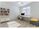 Bright bedroom with desk, computer, bookshelf, and light wood floor at 10742 Cowlite Ave, Las Vegas, NV 89166